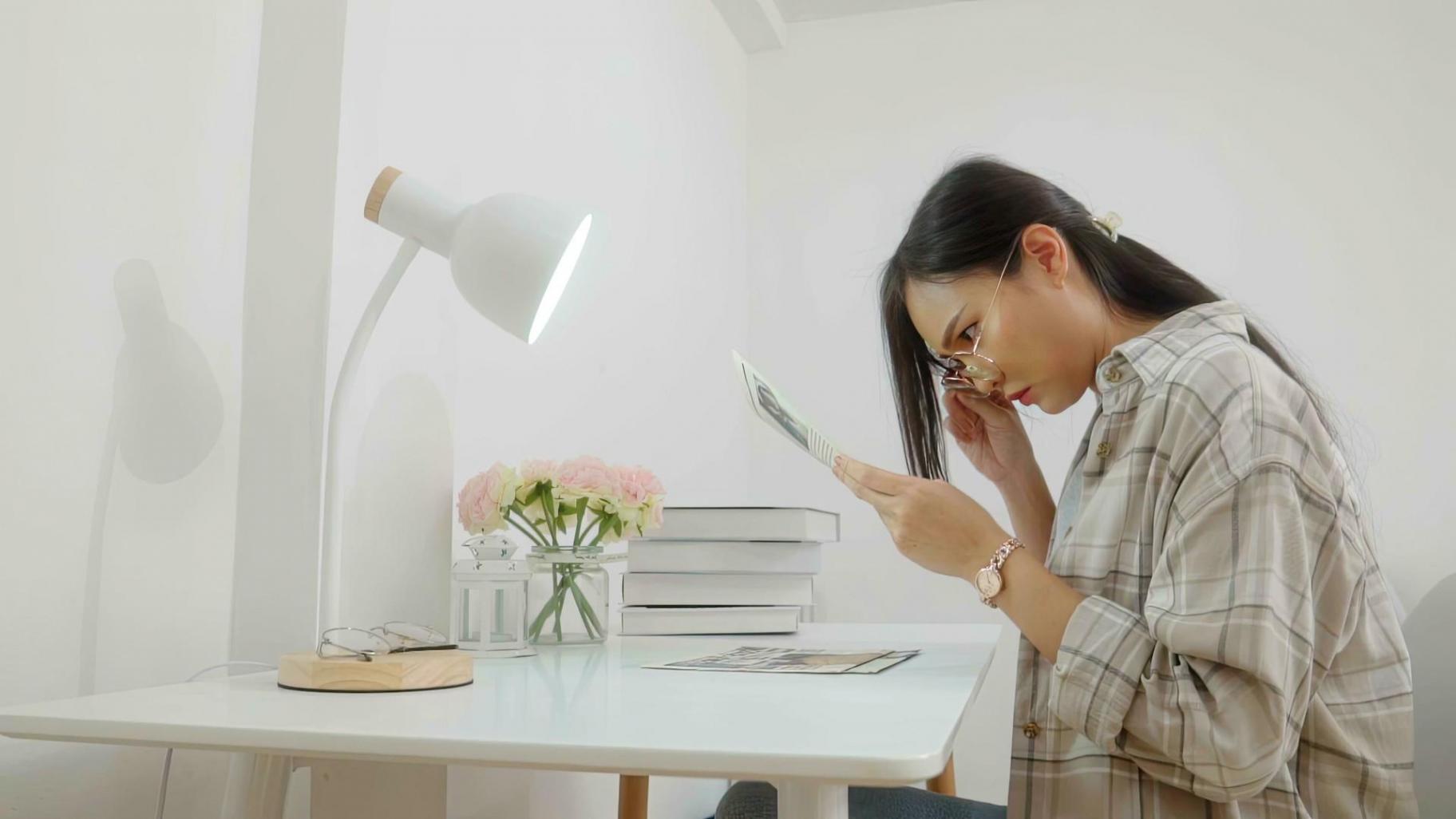 Students working on financial analysis with laptops and calculators in classroom setting